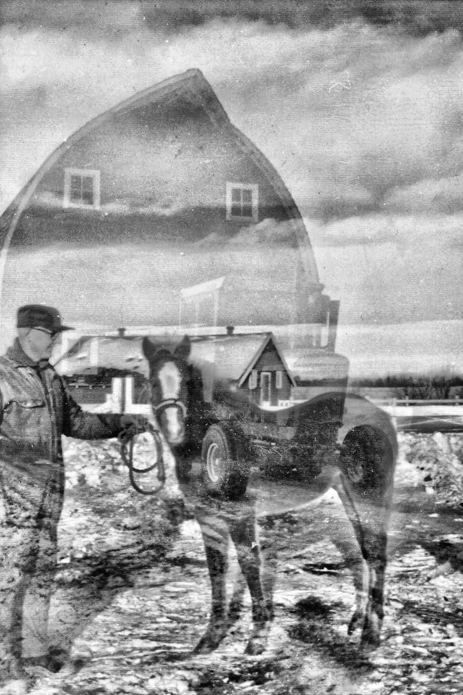 The same double-exposed photograph enhanced in black and white, the curved roofline of the barn and its window coming through more clearly